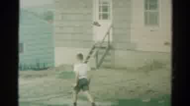 Catskill New York US (1962): A Boy Walking Across A Patch Of Dirt Outdoors And