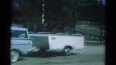 Catskill New York US (1962): Family On Trip Waving From The Car With Car Pulling