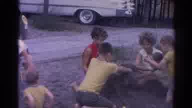 Catskill New York US (1962): Children Play In Dirt While Women Watch And Wash