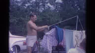 Catskill New York US (1962): Man Untangling Rope So He Can Put Up More Clothes