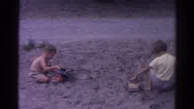 Catskill New York US (1962): Children Playing With Bucks And Toy Dump Trucks In