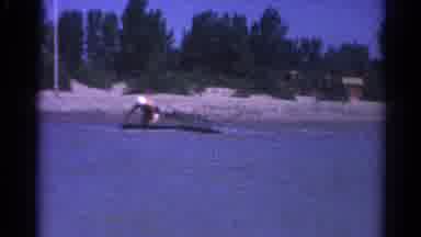 Catskill New York US (1962): Mom Trying To Surf On A Family Vacation But Failing