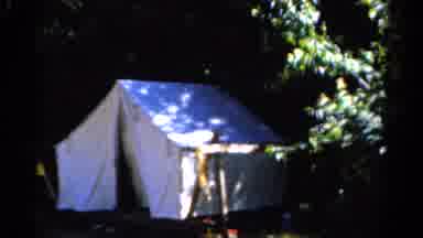 Catskill New York US (1962): Woman Plays Instrument In Front Of White Tent Hidden