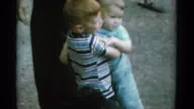 Catskill New York USA (1962): Young Boy Carrying A Younger Boy On A Farm While Two
