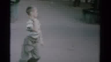 Catskill New York USA (1962): Boy Strutting Through Camping Area To Show Off New