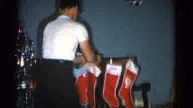 Catskill New York USA (1962): Father Hanging Stockings On The Back Of A Chair With