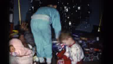 Catskill New York USA (1962): Children Wearing Pajamas Excitedly Unwrapping