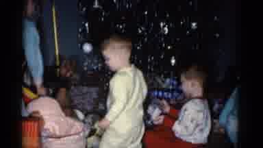 Catskill New York USA (1962): Small Children Wearing Pajamas Excitedly Unwrapping