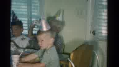 Catskill New York USA (1962): Boy Wearing Grey Shirt Drinks From White Cup At