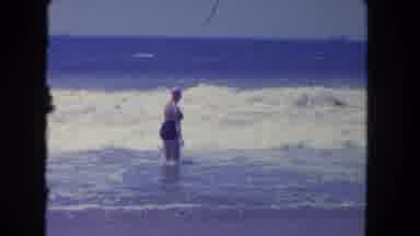 Los Angeles California USA (1962): Woman In One Piece Bathing Suit Frolicking In