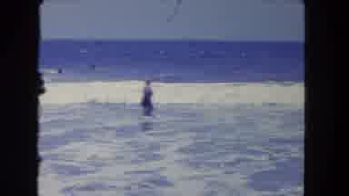 Los Angeles California USA (1962): View Of Ocean Scene With Swimmers Wading Into