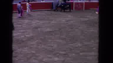 Los Angeles California USA (1962): Two People Running Towards The Bull And Only