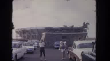 Los Angeles California USA (1962): People Walking In A Parking Lot Past Cars
