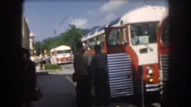 Summit County Colorado USA (1962): Three Buses Parked By The Sidewalk While People