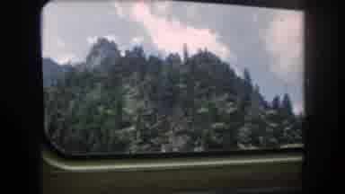 Summit County Colorado USA (1962): Driving Through The Mountains With Evergreens