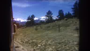 Summit County Colorado USA (1962): Motorized Vehicle Driving Down A Winding Rural