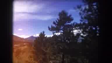 Summit County Colorado USA (1962): Vehicle Rides Down A Road Through Mountainous