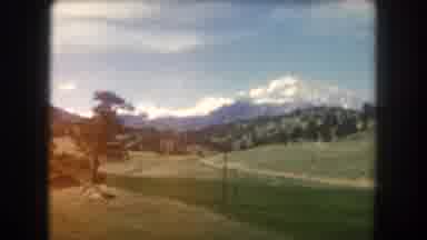 Summit County Colorado USA (1962): Driving By Snow-Capped Mountain