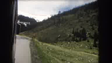 Summit County Colorado USA (1962): View From Moving Bus Of Green Hills And Snowy