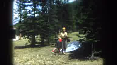 Summit County Colorado USA (1962): Two Women In A Forest One Touches A Nearby Tree