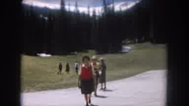 Summit County Colorado USA (1962): People Walking Up And Down Street By Open Field