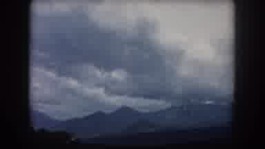Summit County Colorado USA (1962): Passing View Of Mountains And Trees On A Cloudy