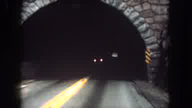 Summit County Colorado USA (1962): Driving Through A Brick Lined Dark Tunnel On A
