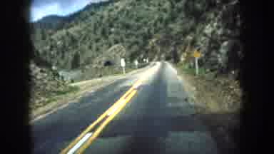Summit County Colorado USA (1962): A Vehicle Drives Through A Mountain With A