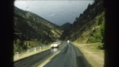 Summit County Colorado USA (1962): Driving On Two-Lane Road Through Mountain