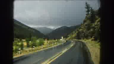 Summit County Colorado USA (1962): White Car Roaming The Mountain Roads