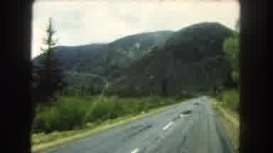 Summit County Colorado USA (1962): Car View Of Street And Mountains And Green