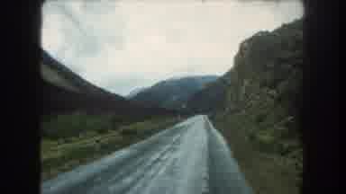 Summit County Colorado USA (1962): Wet Road On A Mountainside On A Cloudy Day For