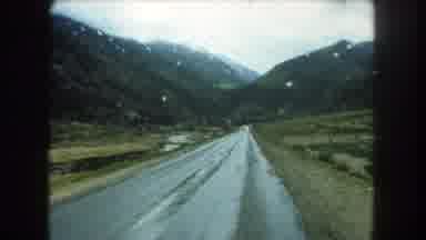 Summit County Colorado USA (1962): Driving Down A Lonely Road On A Rainy Day