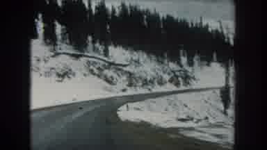 Summit County Colorado USA (1962): Afternoon Drive Along A Wet Country Road In The