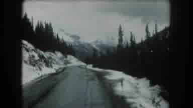 Summit County Colorado USA (1962): Vintage Car Ride Through The Snowy Tree-Covered