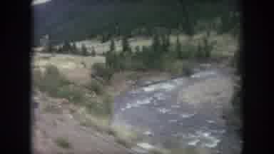 Winter Park Colorado USA (1962): Passing View Of River And Green Trees On A Sunny