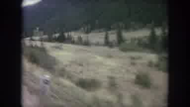 Winter Park Colorado USA (1962): Driving Along A Rural Road With A Field In A