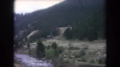 Winter Park Colorado USA (1962): Driving Along Simple Nature Featuring Pine Trees