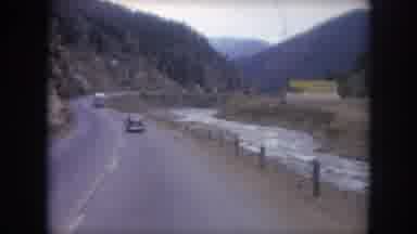 Winter Park Colorado USA (1962): Driving On A Two-Lane Highway Along Side A