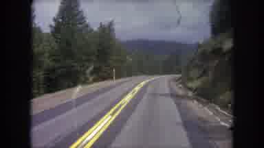 Winter Park Colorado USA (1962): Driving On Mountain Road In Car Green Forest On
