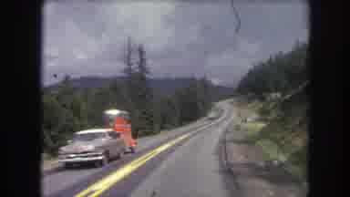 Winter Park Colorado USA (1962): Moving Vehicle View Of Two Lane Road Through