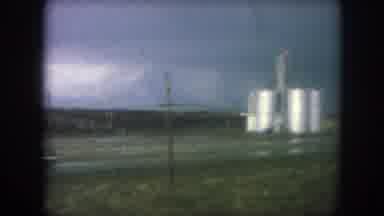 Winter Park Colorado USA (1962): Driving Past A Factory On A Gloomy Day