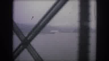 Winter Park Colorado USA (1962): Moving Shot Through A Rail Bridge Of A River On A