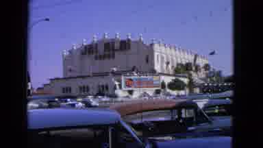 Barrington Illinois USA (1963): Old School Cars Driving Along An Intersection In A