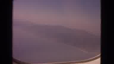 Barrington Illinois USA (1963): Hazy View From An Airplane Window Of Ocean And