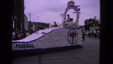 Barrington Illinois USA (1963): Man Walks Beside White Parade Float As It Turns
