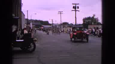 Barrington Illinois USA (1963): Vintage Cars Turn From Parade Route On A Cloudy