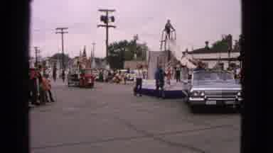 Barrington Illinois USA (1963): People Riding On A Float At A Parade As It Is
