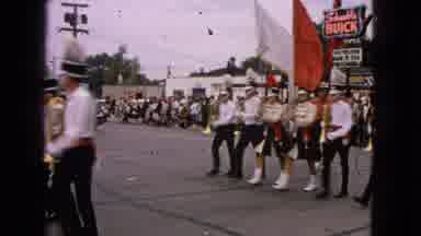 Barrington Illinois USA (1963): Band Marching In A Street While People Watch And A