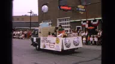 Barrington Illinois USA (1963): People Watching A Small Parade In Front Of A